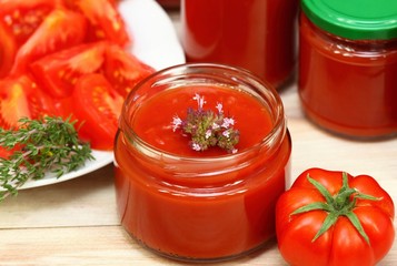 Making homemade tomato ketchup with  oregano spice