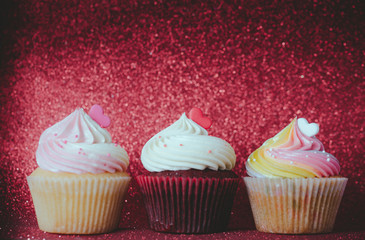 Colorful cupcakes on a bokeh background