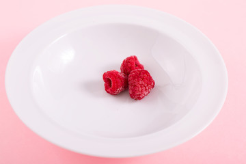 Raspberries in White Plate