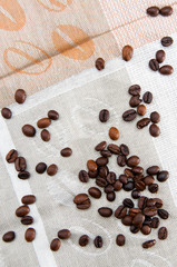 Coffee beans scattered on tablecloths