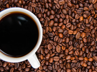 cup of coffee standing on the grains