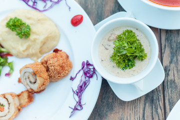 Baked chicken rolls with vegetable salad and mashed potato