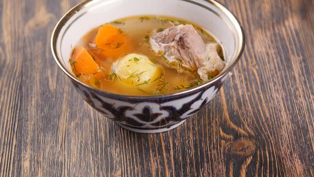 uzbek soup on wooden table