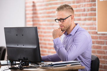 Serious Businessman Using Computer