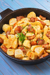 Pan-fried potato and meat. View from above, top studio shot