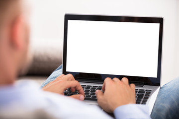 Fototapeta na wymiar Close-up Of A Man Holding Laptop