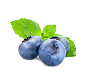 Blueberry. Fresh berries with leaves isolated on white background.