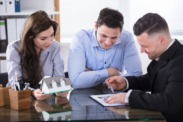 Real Estate Agent Meeting With Couple