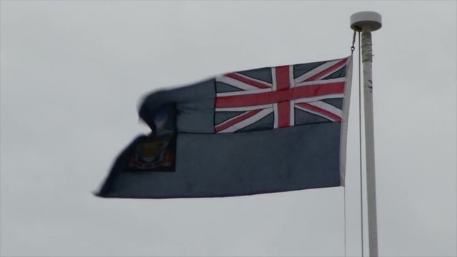 Falkland Island flag flies in a stiff breeze in Port Stanley