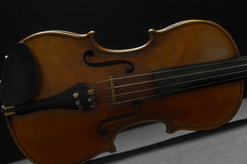 Old violin on a black background