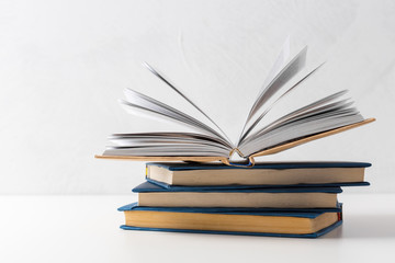  pile of paperback books on a table