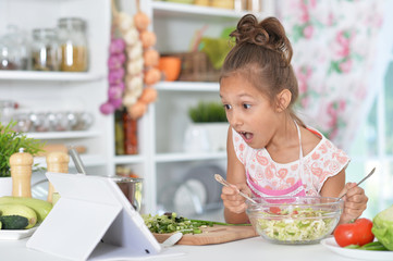little girl preparing meal