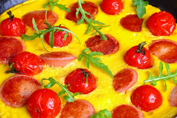 delicious omelette with sausages cut in slices