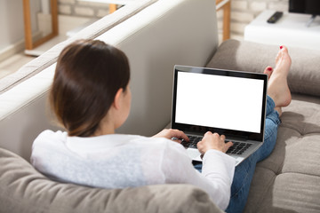 Woman Browsing On Laptop