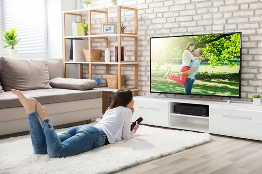 Woman Watching Television At Home