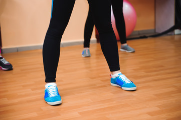Fototapeta na wymiar muscle female legs on fitness training