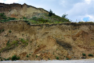 Steep precipice of the coastline. Emergency condition of the slope.