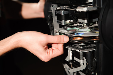 The equipment repair engineer diagnoses the breakdown of light equipment