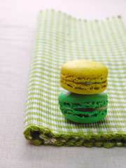 Obraz na płótnie Canvas Duet of macaroons in flavor of lemon and mint.