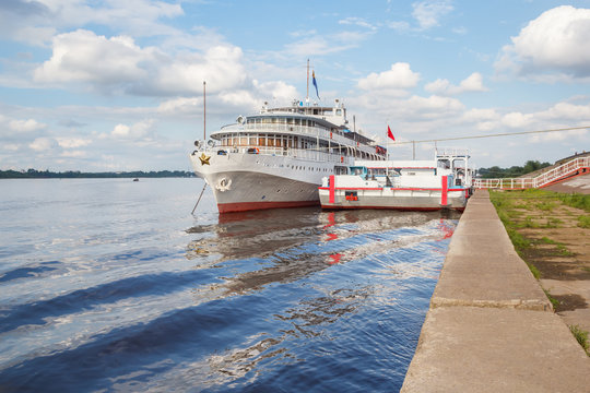 Passenger ship with a reflection in the river in a parking lot in Nizhny Novgorod