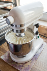 Food processor to kneading dough for cake. Manufacturing process of sweet cake in mixer