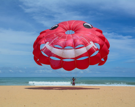 People playing parasailing in Phuket, Thailand.
