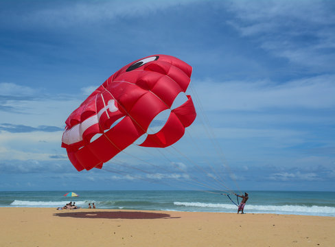 People playing parasailing in Phuket, Thailand.