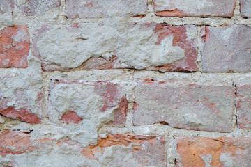 old plaster on a brick wall