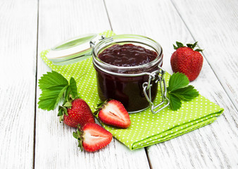Strawberry jam and fresh strawberries