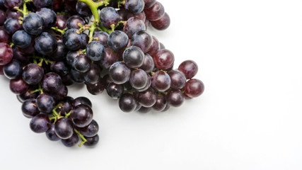 Bunches of ripe grapes on a white background.