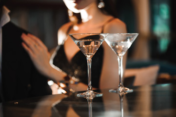 Two glasses of martini coctail in a bar