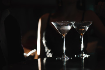 Two glasses of martini coctail in a bar