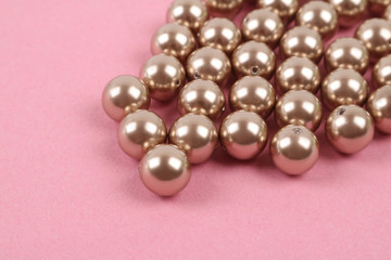 Pearls loose on colored backdrop