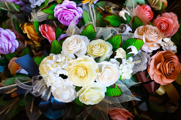 A coffin with a flower arrangement in a morgue