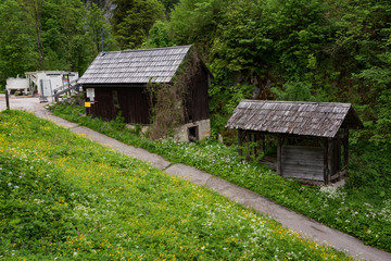 Typical Austrian Alpine houses with bright flowers, Hallstatt, Austria, Europe