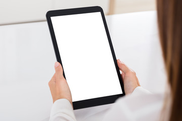 Human Hand Holding Digital Tablet