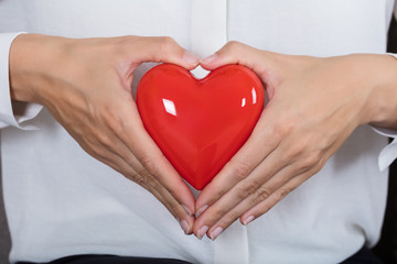 Obraz premium Woman Holding Red Heart