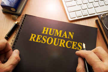 Book with name human resources in an office.