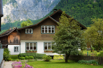 Typical Austrian Alpine house with bright flowers, Hallstatt, Austria, Europe