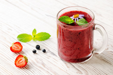 Smoothie with blueberries, banana and strawberry