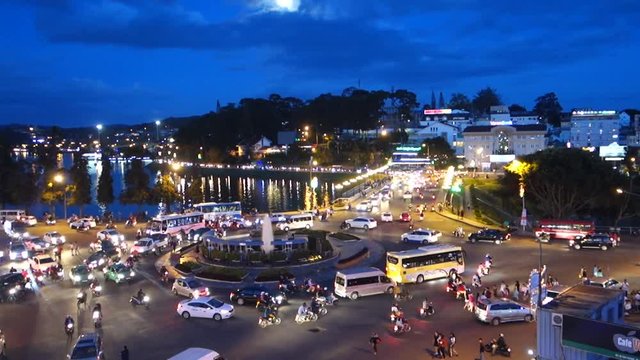 Da Lat city - July 12 2017: A lot of unidentified people drive by motorcycles, car, bus, truck and walking in Da Lat center market. This place is the most popular shopping in Da Lat, Lam Dong, Vietnam