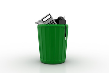 Electronic waste in green trash can