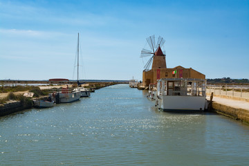 Naklejka premium Salt mills are seen in suburbs of Marsala, Sicily, Italy.
