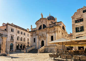 People and terrace cafe at St Blaise Church Stradun Dubrovnik, Croatia