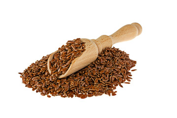 Flax seeds and spoon on white background