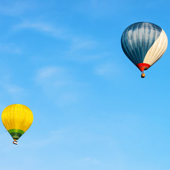 Fototapeta premium Blue and yellow colored hot air balloons in sky Vilnius
