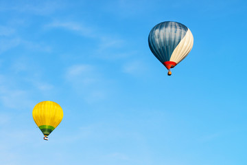 Blue and yellow colored hot air balloons in sky