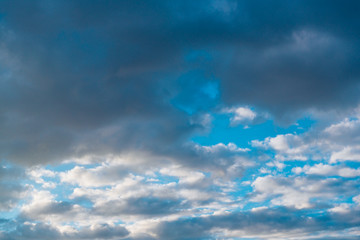 Naklejka na ściany i meble Open blue sky in the clouds, before the storm