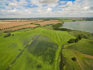 Fototapeta na wymiar Aerial view of flooded agricultural fields after storm with heavy rain in germany