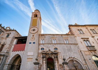 Fototapeta na wymiar Belfry in Stradun Street in Old city Dubrovnik